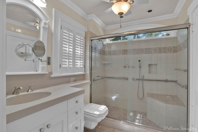 bathroom featuring plenty of natural light, toilet, crown molding, and vanity