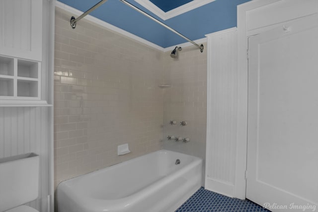 bathroom with tile patterned floors, tiled shower / bath combo, and ornamental molding