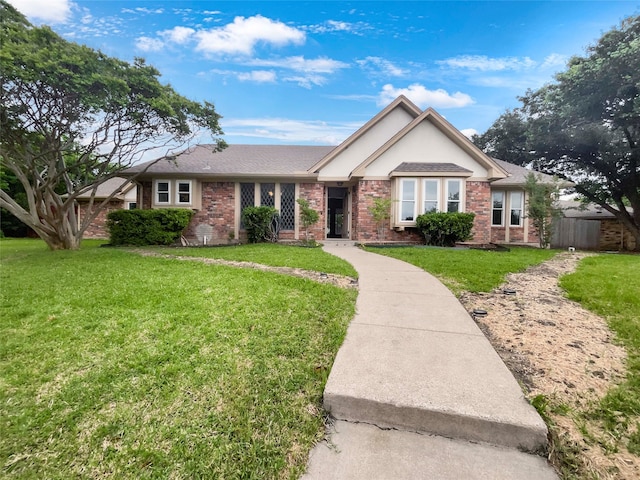 ranch-style home with a front lawn