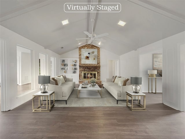 living room featuring a fireplace, vaulted ceiling with beams, hardwood / wood-style floors, ceiling fan, and built in features