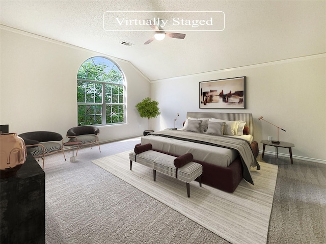 bedroom with carpet, ceiling fan, lofted ceiling, and a textured ceiling