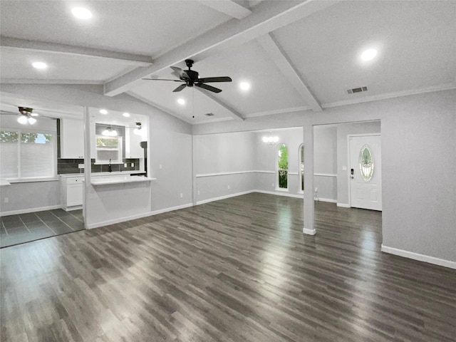 unfurnished living room featuring a textured ceiling, lofted ceiling with beams, dark hardwood / wood-style floors, and ceiling fan