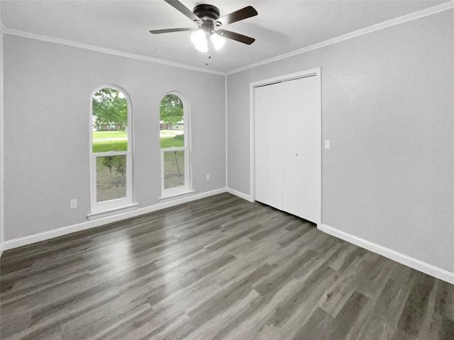 interior space featuring ceiling fan, dark hardwood / wood-style floors, and ornamental molding