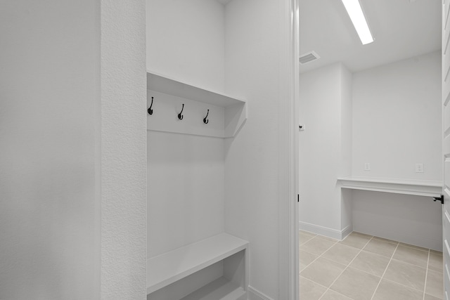 mudroom with light tile patterned floors