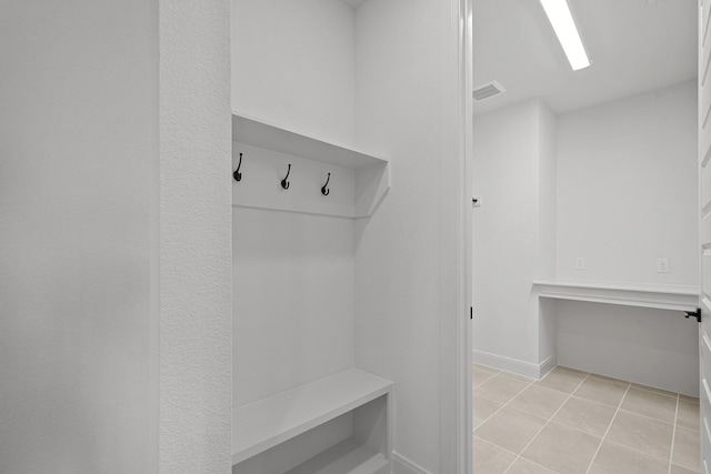 604 Lundy Ln, Mansfield, TX 76063 - mudroom featuring light tile patterned flooring and baseboards