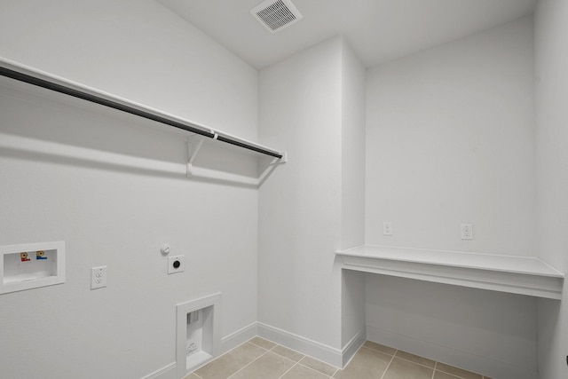 604 Lundy Ln, Mansfield, TX 76063 - laundry area featuring hookup for an electric dryer, gas dryer hookup, washer hookup, baseboards, and light tile patterned floors