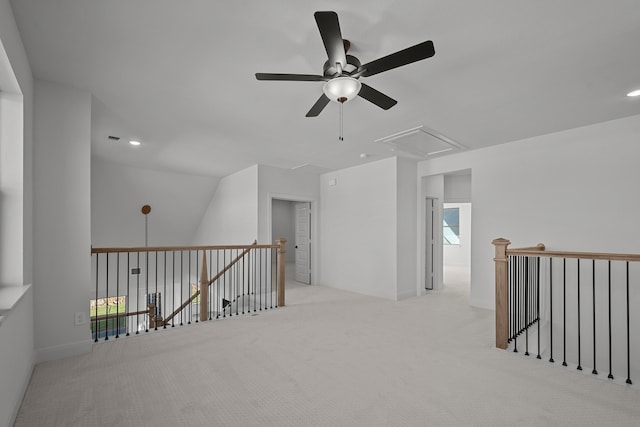 interior space featuring light colored carpet, ceiling fan, and lofted ceiling