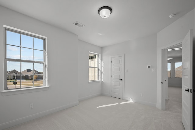 unfurnished bedroom with light carpet