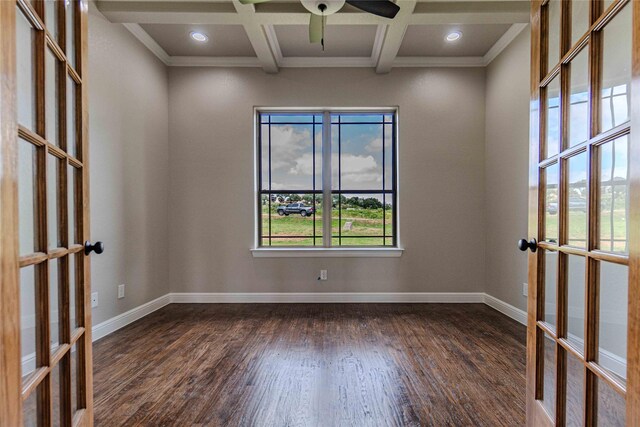 empty room with beamed ceiling, french doors, dark hardwood / wood-style floors, and coffered ceiling