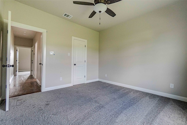 unfurnished bedroom featuring ceiling fan and carpet floors