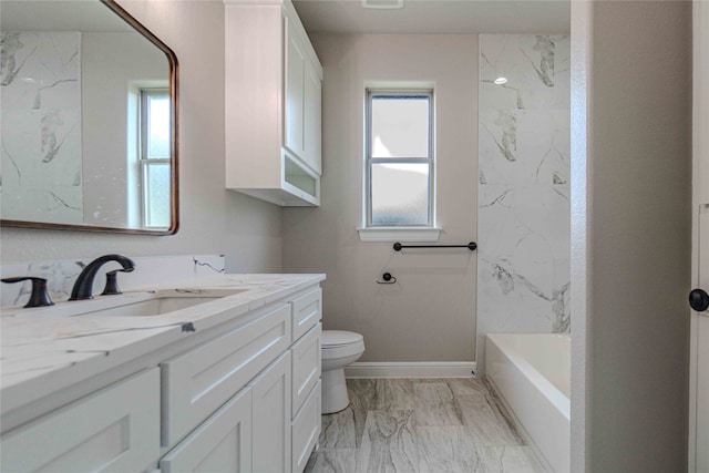 full bathroom with vanity, bathtub / shower combination, and toilet