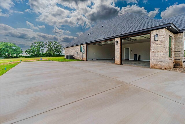 exterior space with a patio and central AC unit