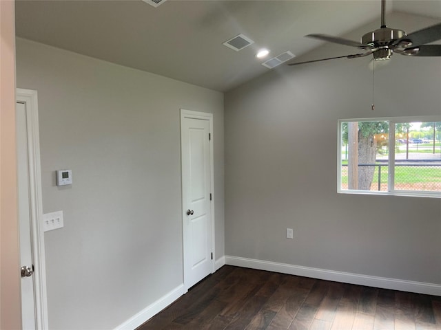 unfurnished room with ceiling fan, dark hardwood / wood-style flooring, and vaulted ceiling