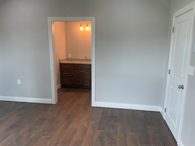 interior space featuring ensuite bath and sink