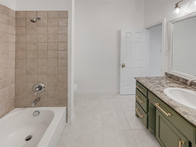 full bathroom featuring toilet, tile patterned flooring, vanity, and tiled shower / bath