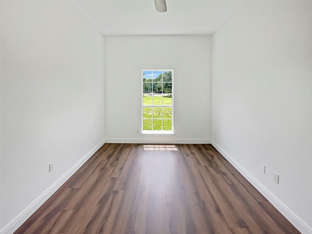 unfurnished room featuring dark hardwood / wood-style flooring