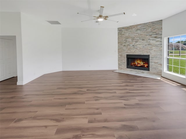 unfurnished living room with a fireplace, light hardwood / wood-style floors, and ceiling fan