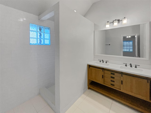 bathroom featuring vanity, lofted ceiling, and tile patterned flooring