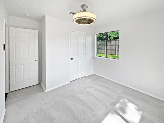 full bathroom with tile patterned flooring, double vanity, and a tile shower