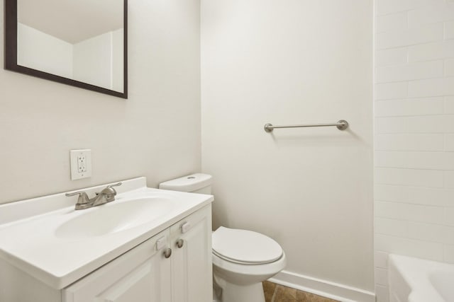 bathroom with toilet, vanity, and hardwood / wood-style flooring