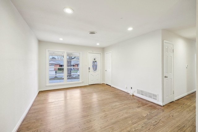 foyer entrance with light wood-type flooring