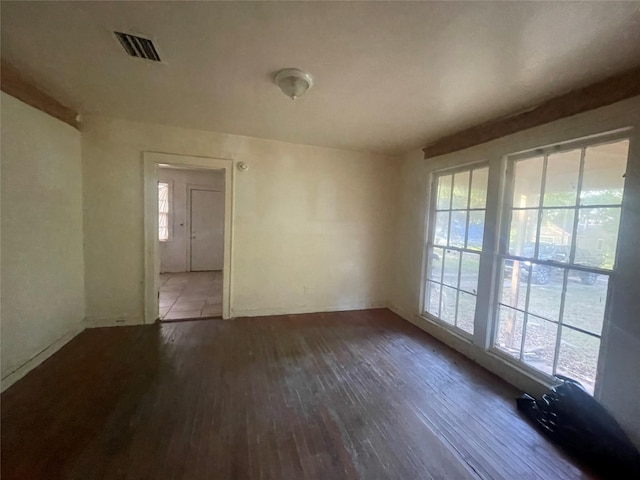 unfurnished room featuring hardwood / wood-style flooring