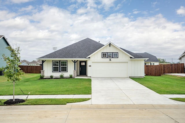 view of front of property featuring a garage and a front yard