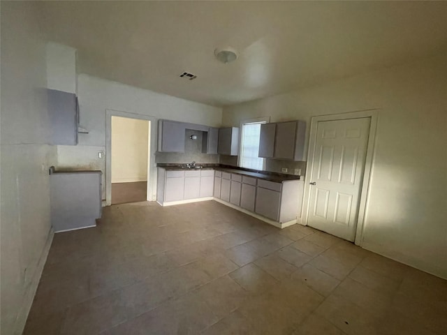 kitchen with gray cabinets and sink