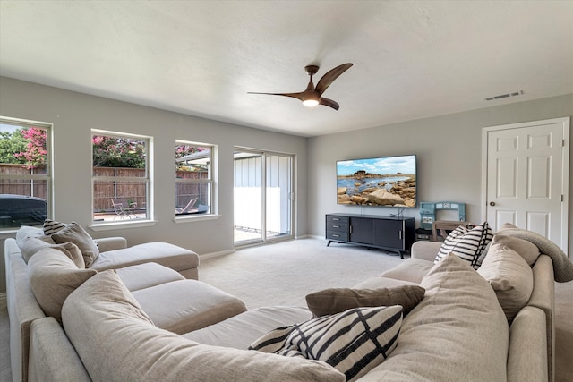 living room with ceiling fan and light carpet