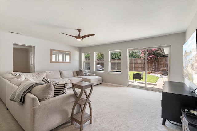 living room with ceiling fan and light carpet