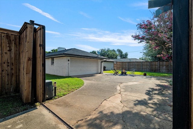 garage featuring a lawn