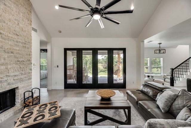 living room with high vaulted ceiling, a fireplace, light tile flooring, and ceiling fan