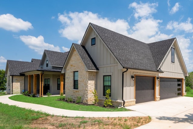 modern farmhouse with a garage and a front yard