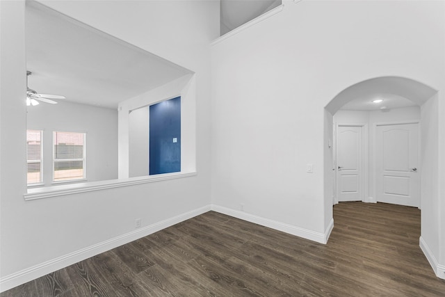 spare room featuring dark hardwood / wood-style floors and ceiling fan