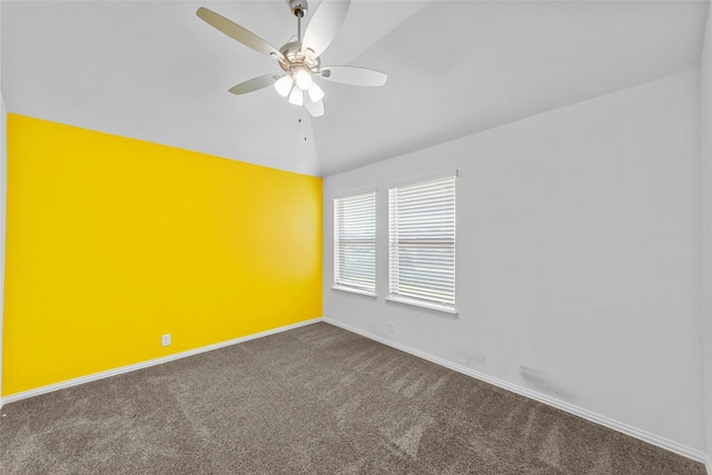 unfurnished room featuring lofted ceiling, ceiling fan, and carpet flooring