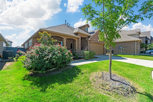 view of front facade with a garage and a front yard