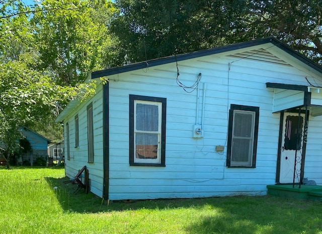 exterior space with a yard