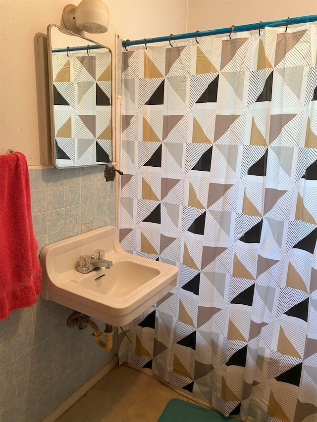 bathroom with tile walls