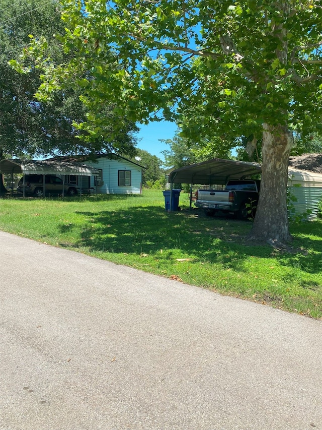 view of front of house featuring a front yard and a carport