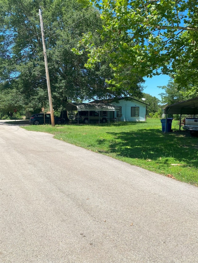 view of front of property featuring a carport