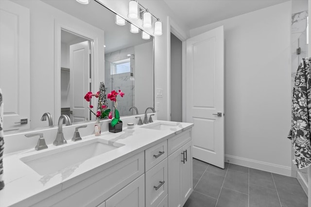 bathroom featuring tile patterned flooring, an enclosed shower, and vanity