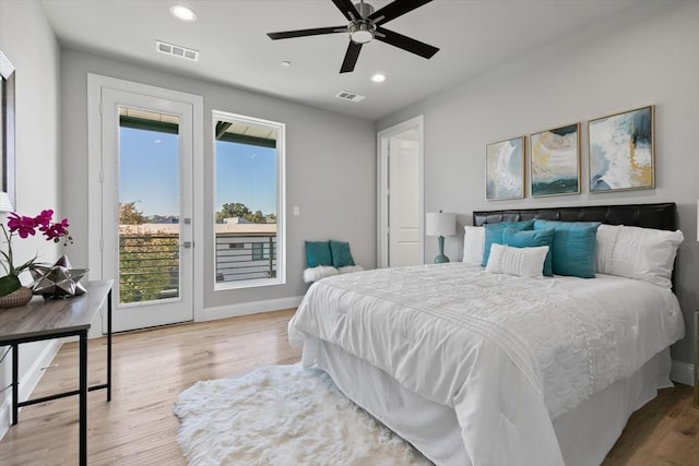 bedroom featuring ceiling fan, hardwood / wood-style flooring, and access to exterior