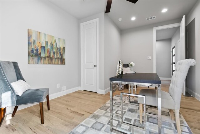 home office with wood-type flooring