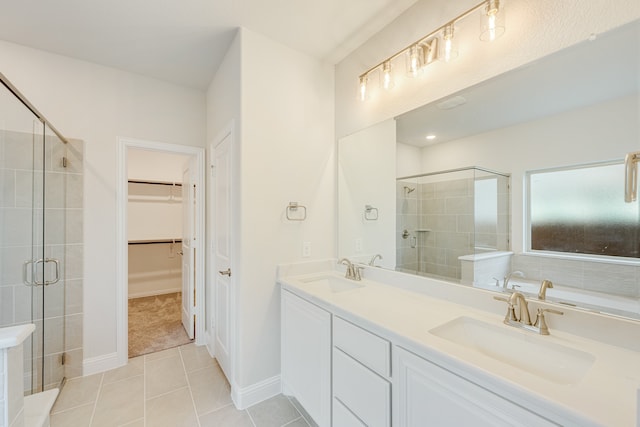 bathroom with vanity, tile patterned flooring, and an enclosed shower