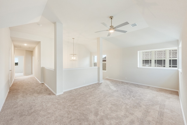 carpeted empty room featuring lofted ceiling and ceiling fan