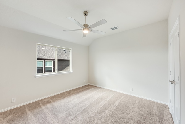 unfurnished room with carpet, lofted ceiling, and ceiling fan