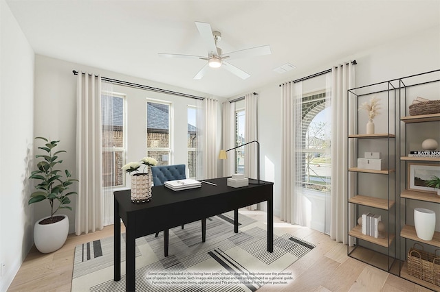 home office featuring light hardwood / wood-style floors and ceiling fan