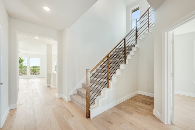 stairway featuring wood-type flooring