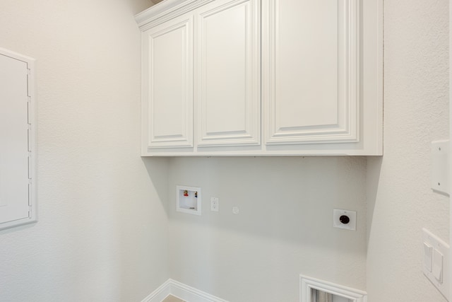 washroom featuring washer hookup, cabinets, and hookup for an electric dryer