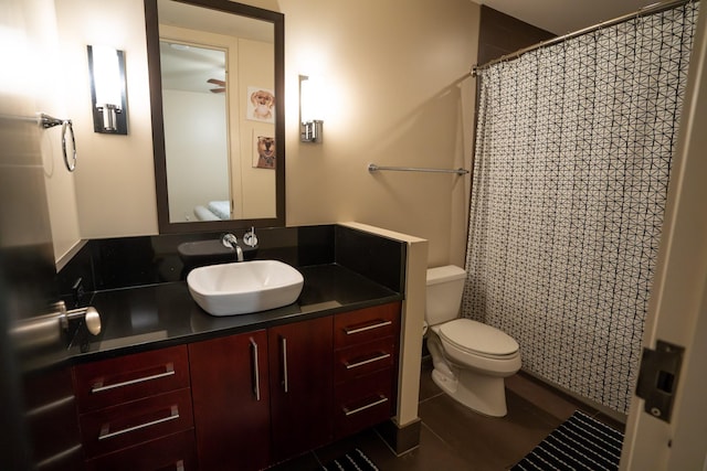 bathroom featuring wood-type flooring, vanity, and toilet